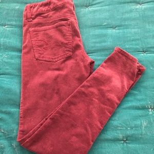 AE burgundy skinny pants
